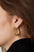 drop shaped earrings with stones