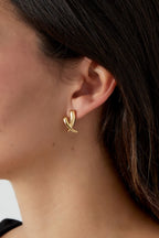 crossed earrings