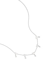 Necklace with alternating hearts and dangling stones