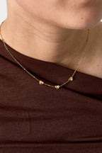 Necklace with beads and hearts with stone