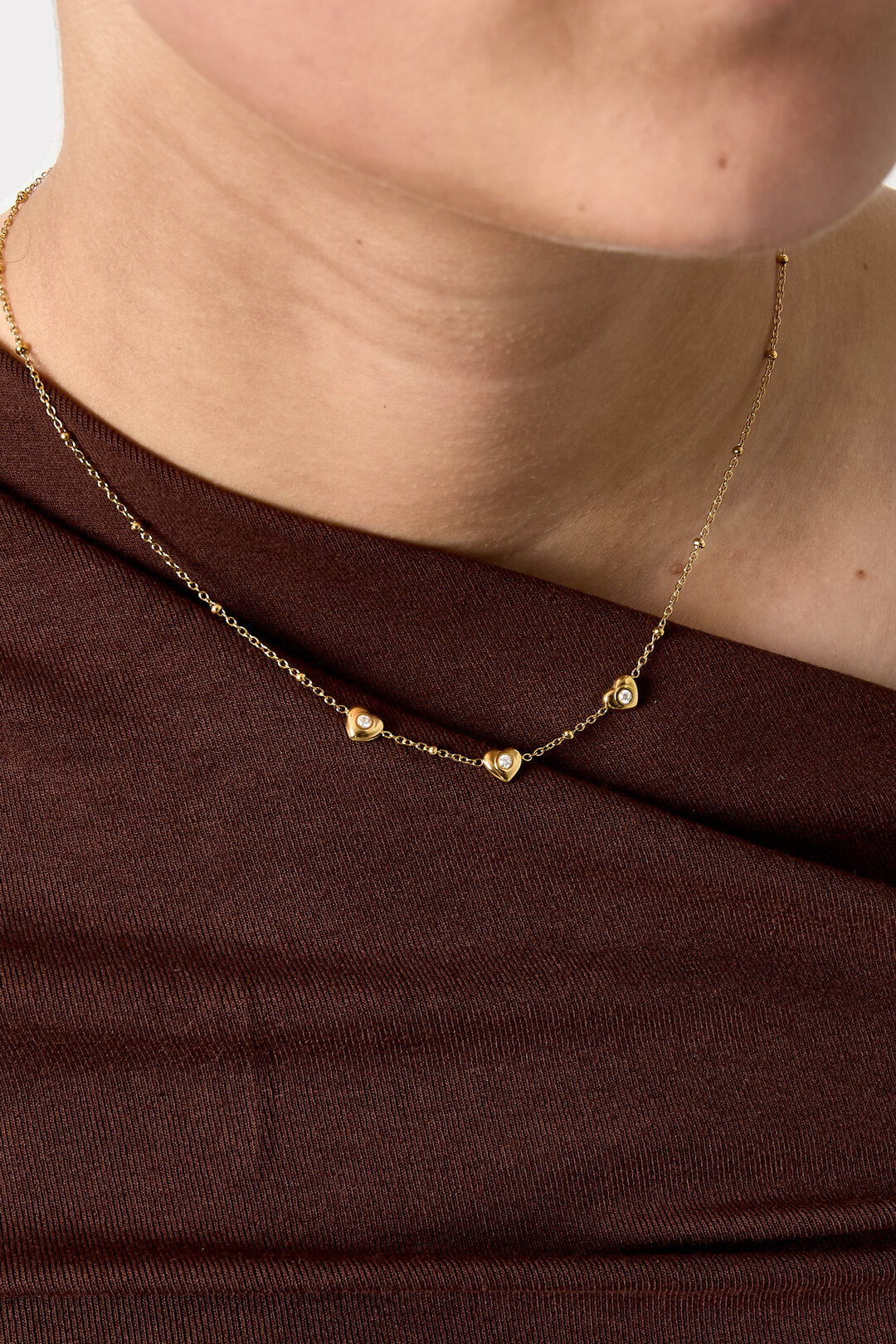 Necklace with beads and hearts with stone