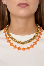 Bead necklace with clover beads