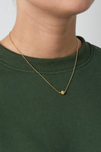 Minimalist necklace with a clover
