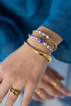 Solid beaded bracelet with beads in a blue floral print