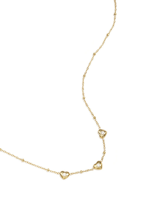 Necklace with beads and hearts with stone