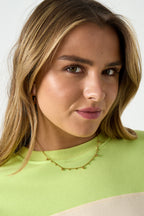 Necklace with alternating balls