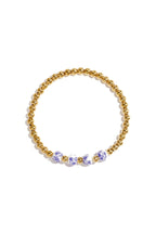 Solid beaded bracelet with beads in a blue floral print