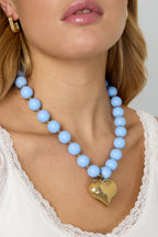 Bead necklace with hanging heart