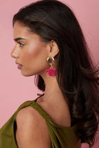 Round earrings with hanging flower