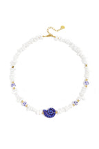 Necklace with stone beads, white beads with blue flowers and statement shell