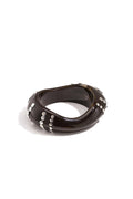 Resin bangle bracelet with studs in a striped pattern