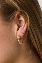 Earrings with alternating stones