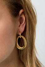 Statement earrings with detailed oval pendant