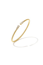 Symmetrically dotted bangle with detailed ends