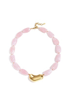 Necklace with asymmetric statement bead